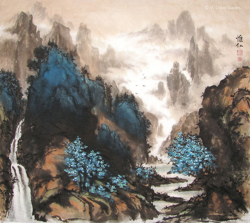 blue cliff and trees with river and brown mountains
